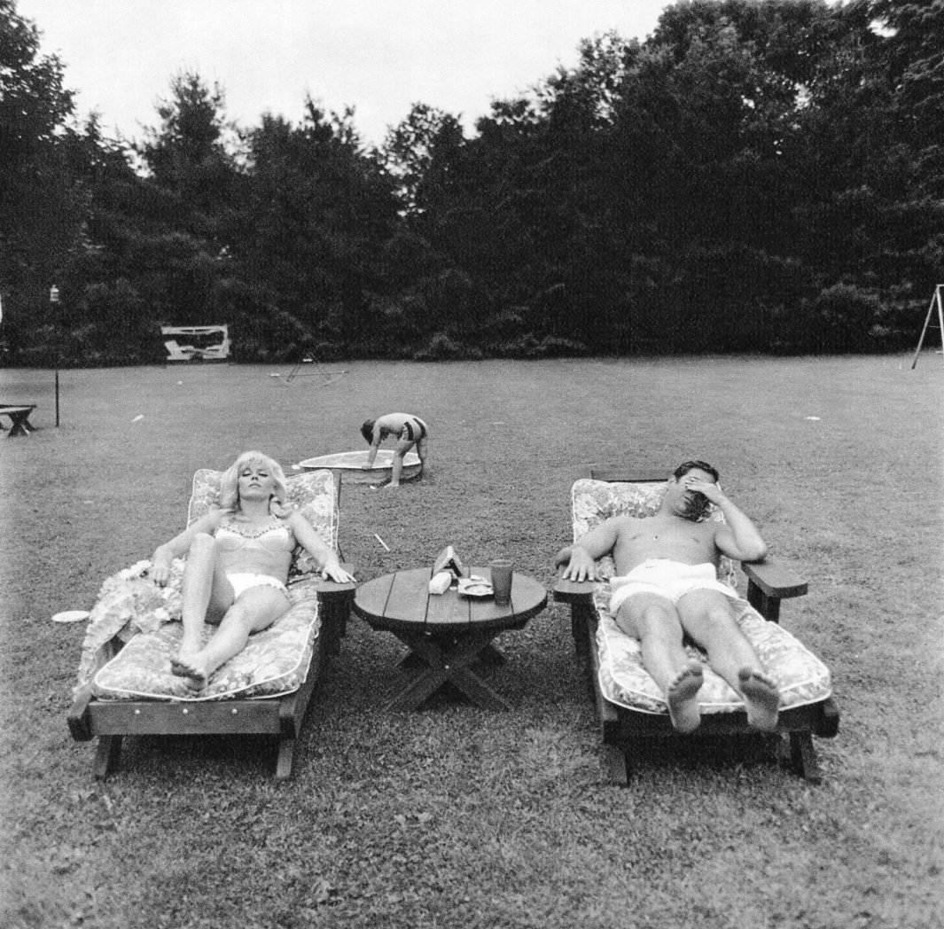 Diane Arbus - Family on their lawn one Sunday, NY: 1972 Sheet-fed Gravure printed by C.J. Bucher (swiss printers) - A FAMILY ON THEIR LAWN ONE SUNDAY IN WESTCHESTER, N.Y., 1968, Image size approx. 7"x7"