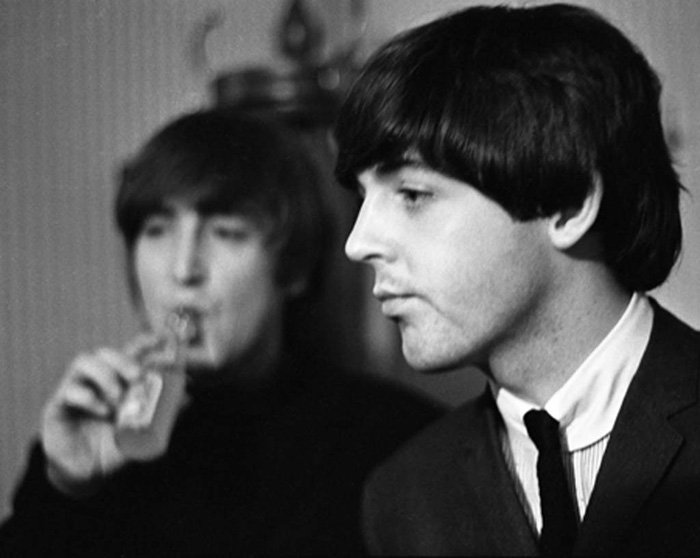 Paul Berriff, Fade Out: John Lennon and Paul McCartney backstage before The Beatles concert at the Odeon Theater, Leeds, England on 22 October 1964. This photograph was taken with a Nikon F 35mm camera using Kodak Tri-x nega