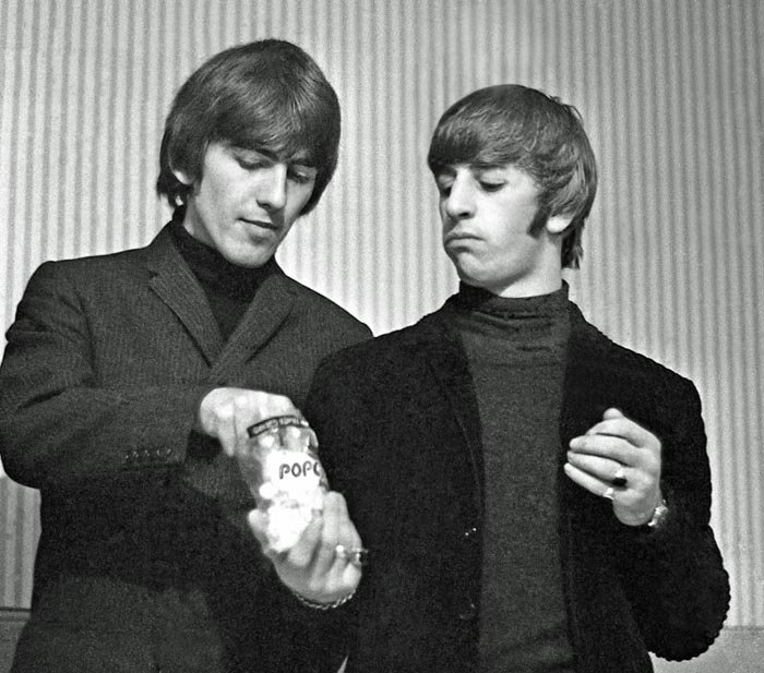 Paul Berriff, Pop Stars: George Harrison and Ringo Starr enjoying popcorn in their dressing room before The Beatles concert at the Odeon Theater in Leeds, England on 22 October 1964. This photograph was taken with a Nikon F 3