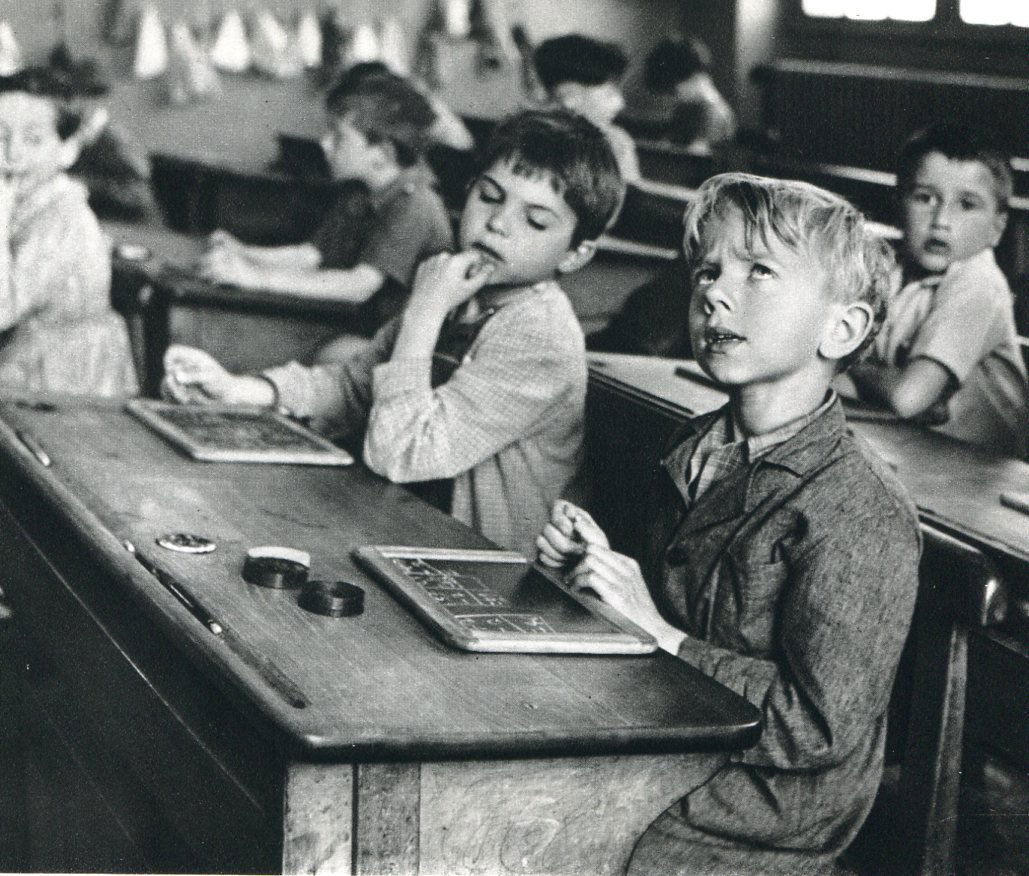 Doisneau, Robert - Acquiring Information: Vintage Sheet-Fed Gravure printed in 1979 by Presses Des Imprimeries, France - Image size approx. 7" x 5.5"