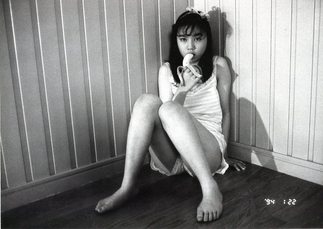 Araki, Nobuyoshi - Girl w/ banana, 1994 - Duotone: This is from a compilation of Mechanical Duotones beautifully printed in 1995 in France - Image size 11 x 7.5 . Photo Mounted with acid free tissue on conservation mat-board