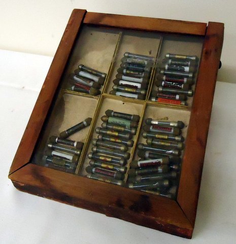 Case of Early Radio Resistors: Lot of 50+ early cartridge-type new resistors in display case- 9"x8"x5". A good assortment of hard-to-find original stock, great for early radio restoration.