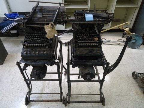 2 Underwood Typewriters on Stands: 2 early Underwood electric typewriters on stands - 41"x25"x22", they appear to have been retrofitted for electric operation