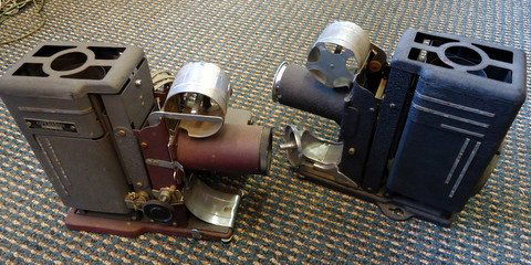 2 Film Strip Projectors: 2 early filmstrip projectors with lenses: Magnavox and Operadio - 10"x8"x4" each