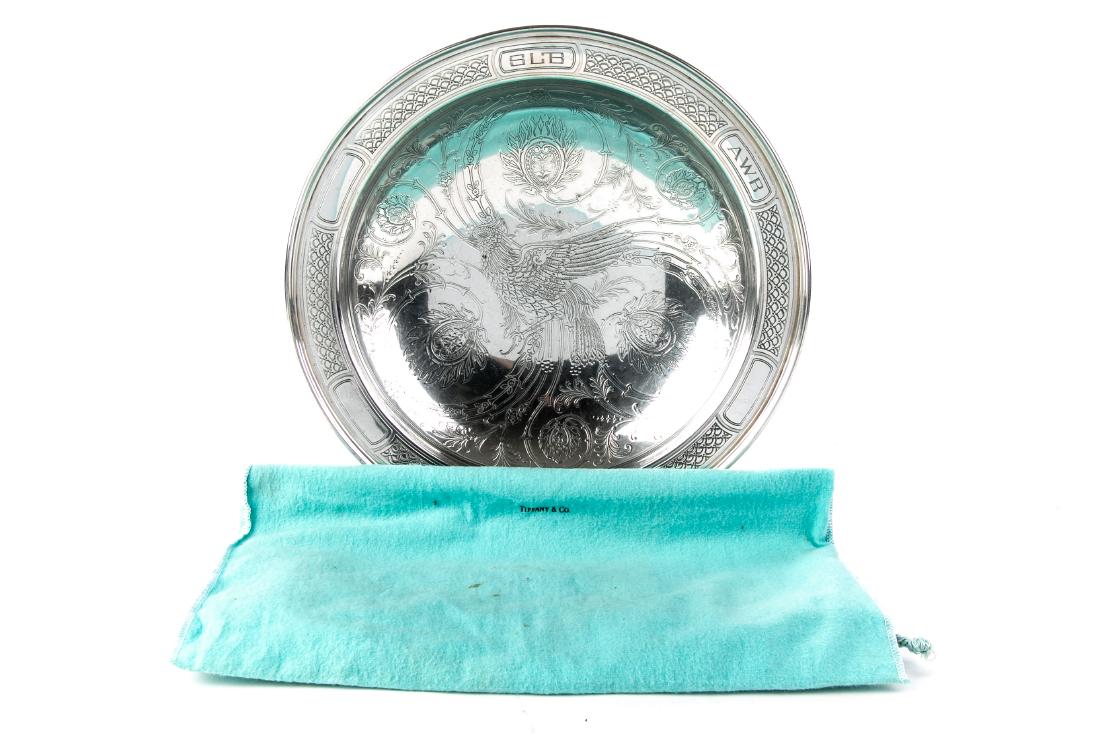 Antique Tiffany Sterling Silver Bird & Foliate Bowl: Aesthetic sterling silver bowl made by Tiffany & Co. in New York, circa 1914. Round with molded rim and foot ring. Acid-etched interior: A persian influenced bird with patterned plumage and loose foli