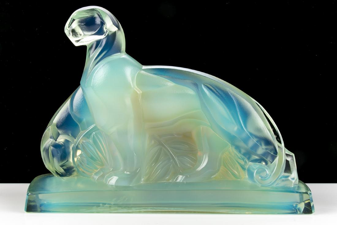 Sabino Glass French Opalescent Panthers Sculpture: Sabino French art deco opalescent glass of two panthers. Beautiful shades of blue, green, gold glass. The two panthers raised up on a plinth base that is signed Sabino Paris Dimensions: 8" L, 3" D and