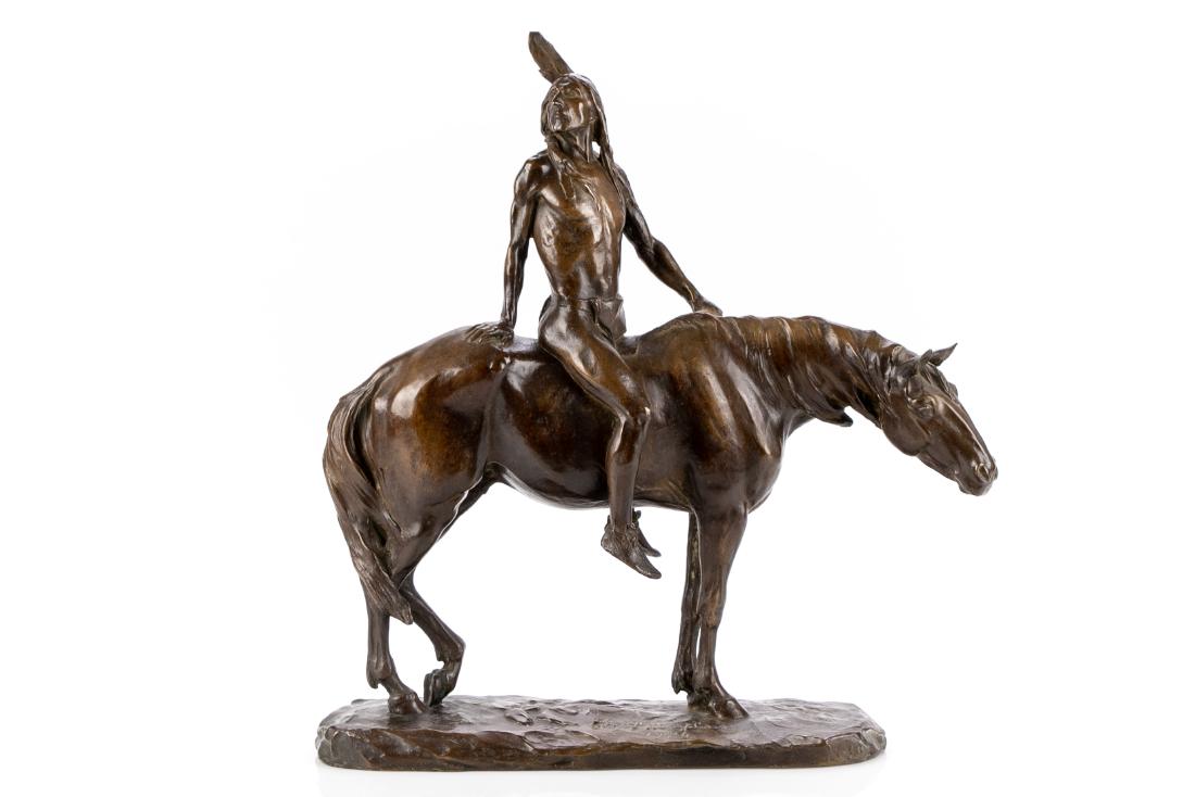 Charles H. Humphries (1867-1934) Indian Bronze By Roman: Bronze figure depicting an Indian brave seated upon a horse at rest. Incised signature on base Chs. H. Humphries and dated 1904. Stamped Roman Bronze Works lower left front edge. Dimensions: 15 1/2" L