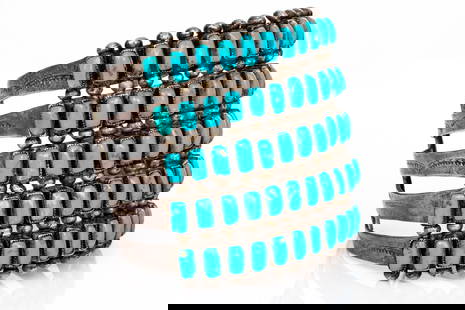 Zuni Eleanor Ahiyite Impactful Enormous Five Row Turquoise Studded And Chased Cuff Bracelet: Zuni Eleanor Ahiyite impactful enormous five row turquoise studded and chased cuff bracelet Marks: None, tests lower grade silver, signed EA (Eleanor Ahiyite) Dimensions: 2 5/16" interior diameter x 2
