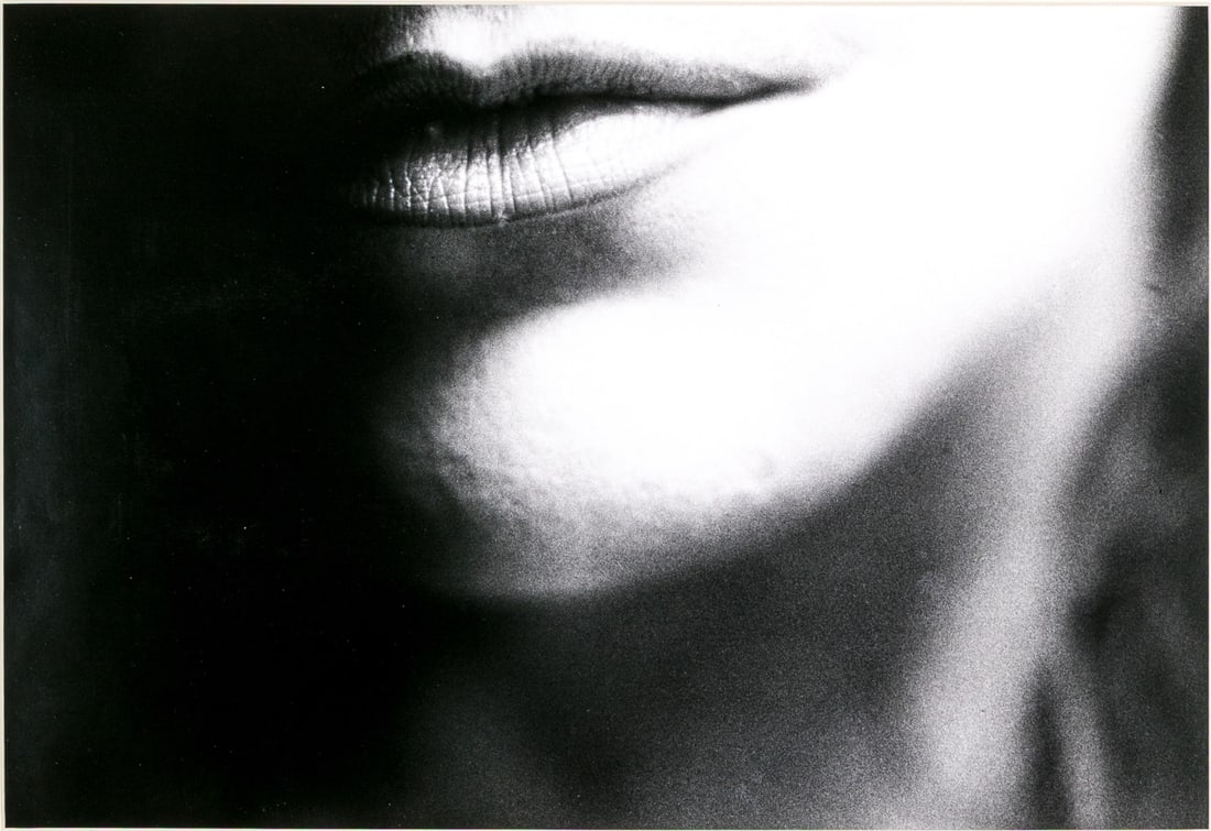 Ralph Gibson (American, B. 1939) "Lips, Rome" Signed Artist's Proof Gelatin Silver Print: Ralph Gibson (American, b. 1939) "Lips, Rome" gelatin silver print depicting the lips and chin of a woman in high contrast. Pencil signed, dated 1987, and editioned ap on the verso. Unframed. Dimensio