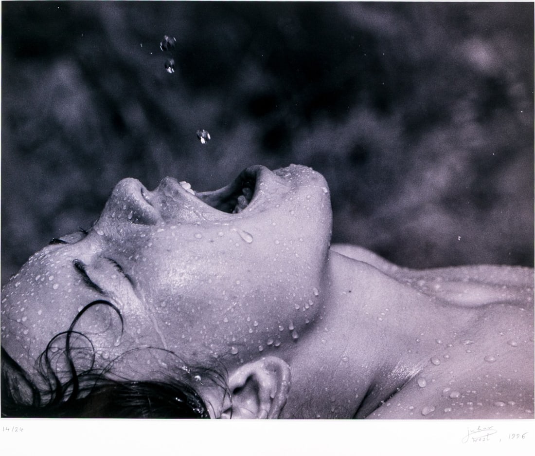 Julian West (American [CA], B. 1964) "A Moment Suspended, 1996" Signed Photographic Print: Julian West (American [CA], B. 1964) "A moment Suspended, 1996" mounted photographic print depicting a figure in profile damp with water droplet, mouth wide open under falling droplets against a dappl