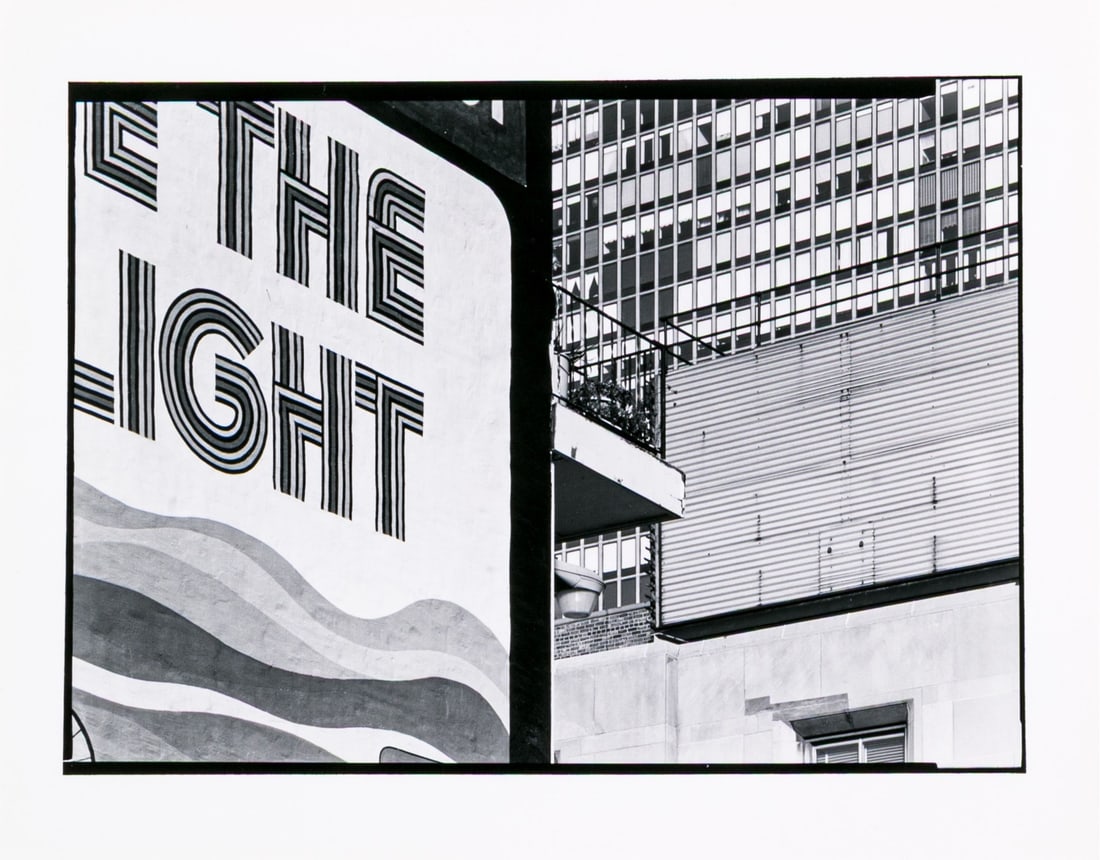 Barbara Crane (American, 1928-2019) "Loophole Symphony" Gelatin Silver Print: Barbara Crane (American, 1928-2019) "Loophole Symphony" photographic print depicting a large advertisement partially reading "The Light" leading to a skyscraper in the background. Handwritten label on
