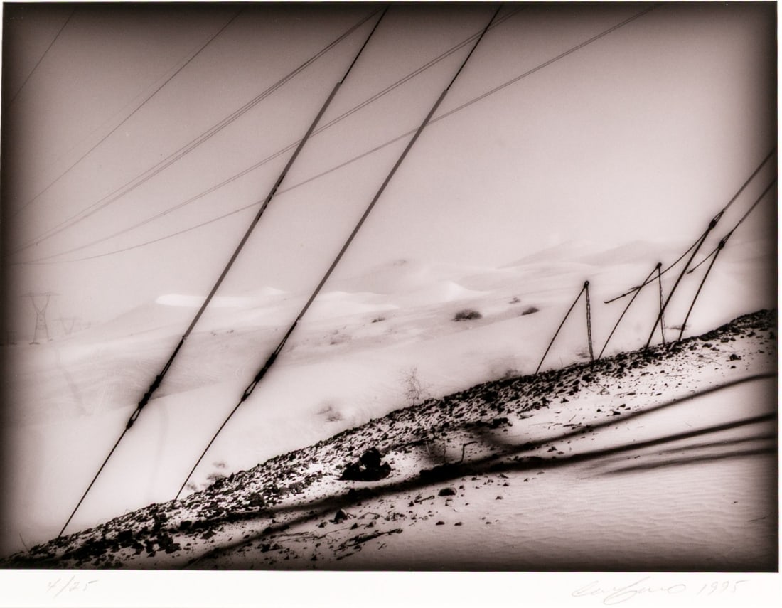 Ray Carofano (American [CA], B. 1942) "High Tension + Dunes No. 2" Signed Gelatin Silver Print: Ray Carofano (American [CA], b. 1942) "High Tension + Dunes No. 2" gelatin silver print mounted on board depicting a monochromatic landscape with high contrasting power lines along sandy dunes dotted 