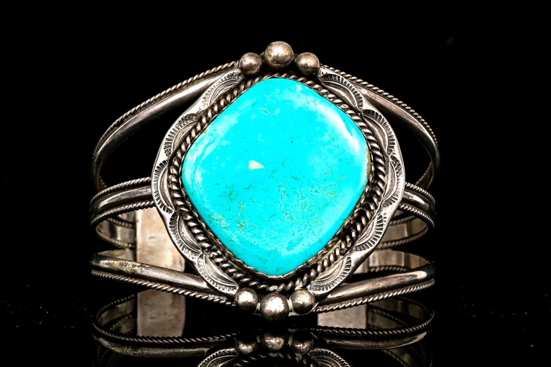 NAVAJO SAMPSON YAZZI MAJESTIC FREEFORM TURQUOISE ULTRA WIDE CUFF BRACELET: This majestic Navajo sterling silver cuff bracelet is by Sampson Yazzi, and features a large, free form turquoise center, decorated with a rope edge and a chased border, with ball punctuations on the 