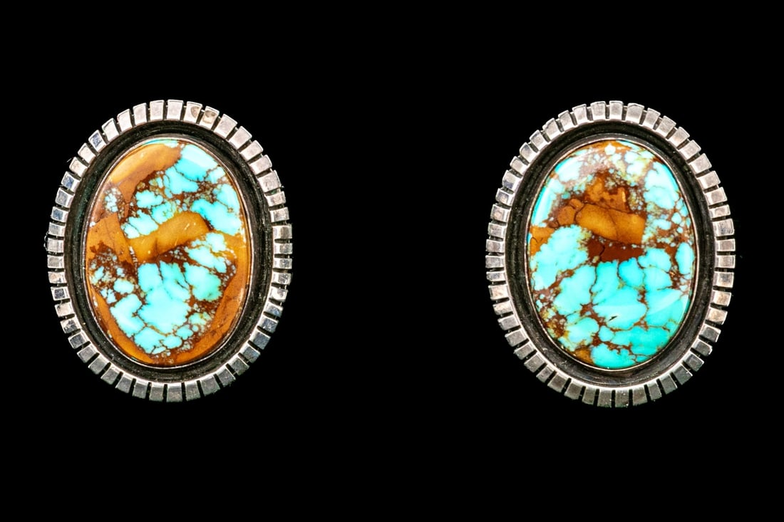 NAVAJO LONNIE WILLIE BEAUTIFUL OVAL STERLING SILVER AND TURQUOISE EARRINGS: These beautiful Navajo sterling silver earrings by Lonnie Willie feature an oval turquoise center, with matrix, finished with a ridged style border. Finished with clip on style backs. "Lonnie Willie w