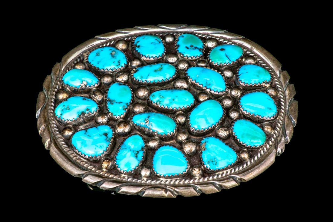 NAVAJO TOMMY MOORE STERLING SILVER DISTINCTIVE LARGE TUMBLED TURQUOISE CLUSTER BELT BUCKLE: This gorgeous ultra large sterling silver Navajo belt buckle is by Tommy Moore, and features an oval profile, set with a cluster of free form cabachon turquoise stones, bezel set, interspersed with ba