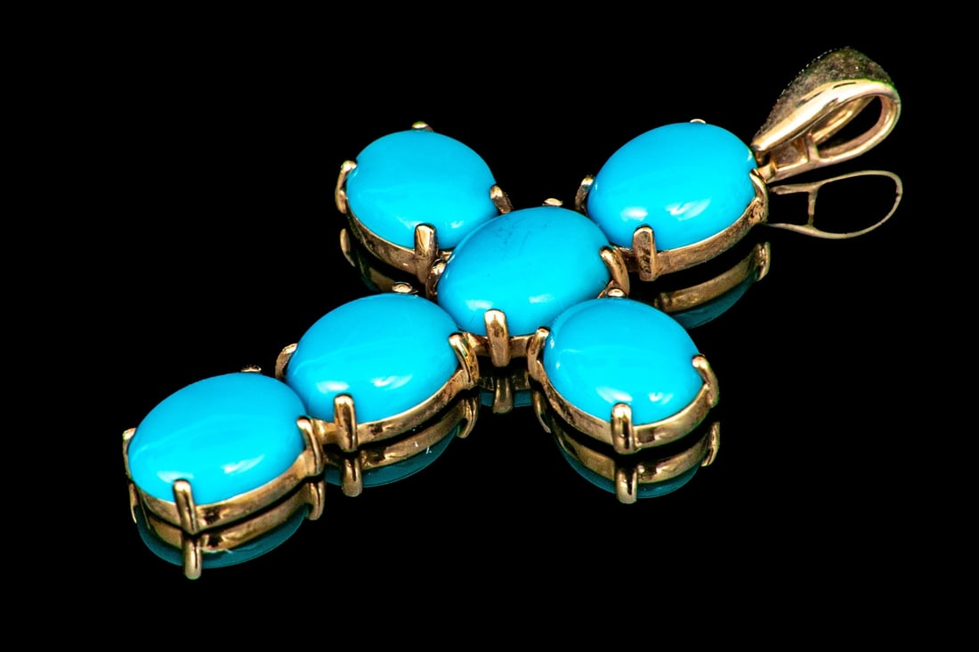 14K YELLOW GOLD HANDSOME LARGE CABACHON CROSS: This handsome 14k yellow gold cross features cabachon cut, blue toned synthetic turquoise stones, prong set, and finished with a solid bale Marks: 14k Dimensions: 1 15/16" long including bale x 1 1/16