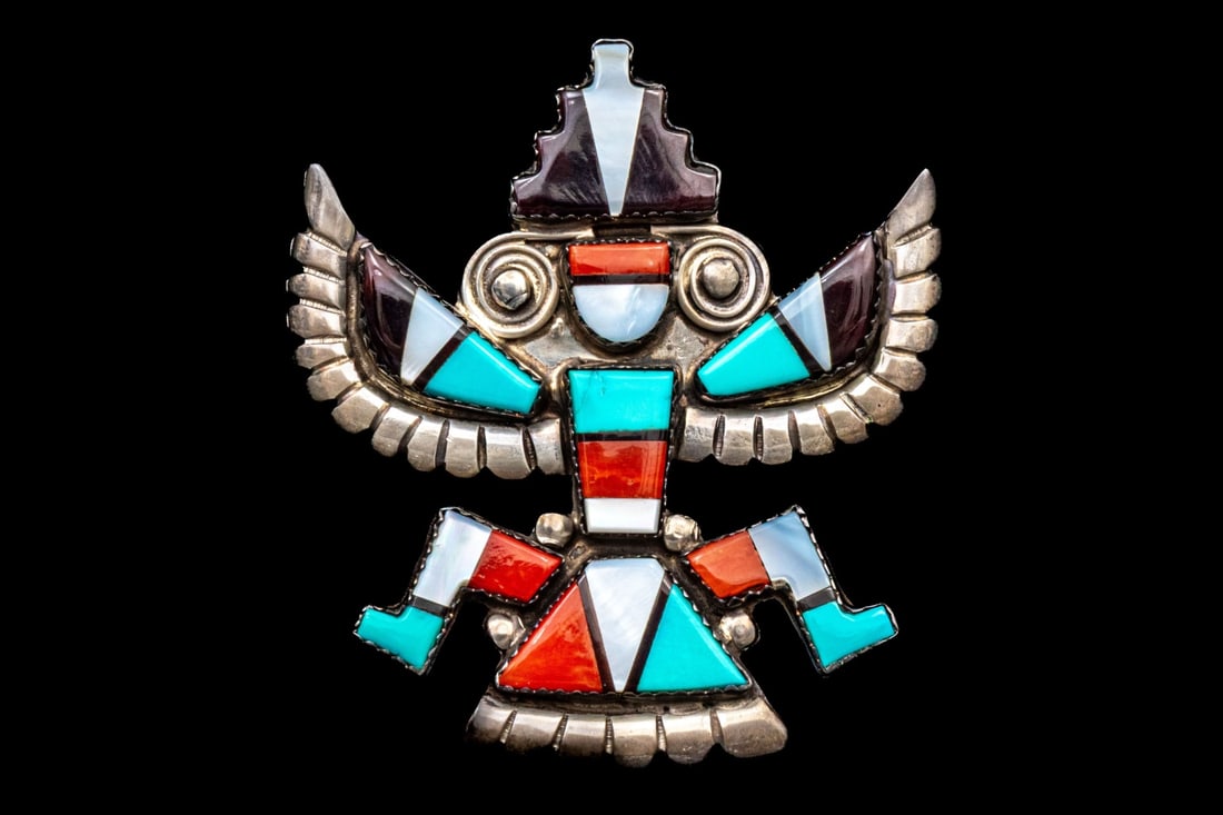 ZUNI ALONZO HUSTITO IMPORTANT STERLING SILVER INLAID "KNIFEWING GOD" BROOCH/PENDANT: Zuni Alonzo Hustito sterling silver inlaid "Knifewing God" brooch/pendant, set with turquoise, mother-of-pearl, carnelian and onyx. "Alonzo Hustito (1903–1989) was a master Zuni Pueblo silversmith a