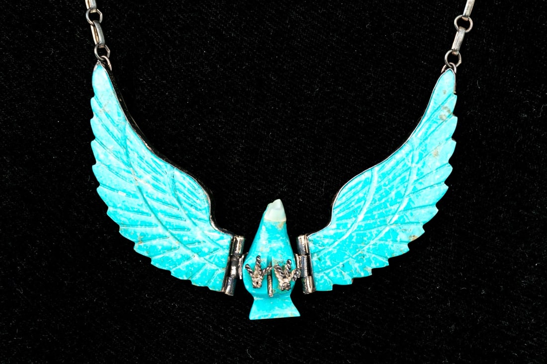 NAVAJO IMPOSING LARGE STERLING SILVER CARVED TURQUOISE EAGLE NECKLACE: This imposing Navajo sterling silver necklace features a large, center carved turquoise eagle in flight, hinged, displayed on an elongated chain necklace and finished with a spring ring style claspMar
