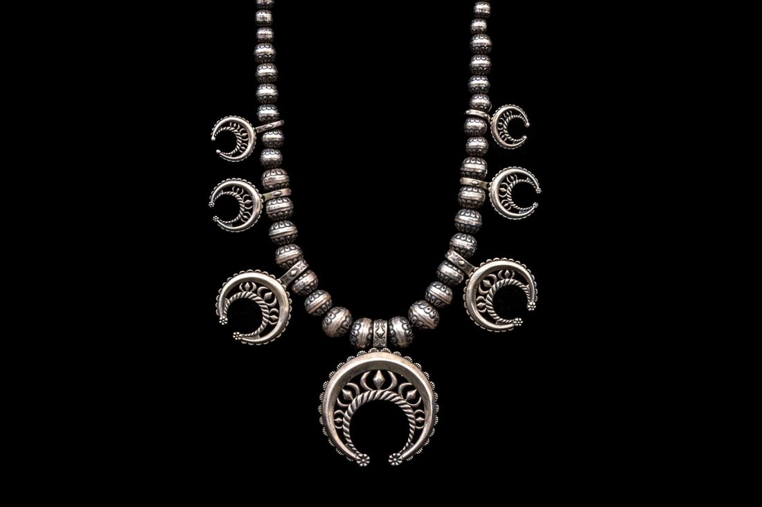 CAROLYN POLLACK STERLING SILVER STRIKING NAJA MOTIF AND BEAD STYLE NECKLACE: Carolyn Pollack sterling silver striking naja motif and bead style necklace, finished with a lobster claw style clasp. Carolyn Pollack is a renowned jewelry designer famous for her high-quality sterli