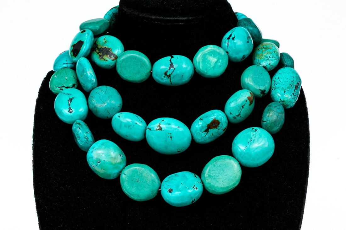 EXTRAORDINARY HEAVY OBLONG TURQUOISE AND HOWLITE ROPE LENGTH NECKLACE 58" L: This extraordinary turquoise and howlite necklace features heavy oval beads, slightly graduated and finished with a decorative spring ring style clasp Marks: 925 Dimensions: 58" long to 56" long x 11/