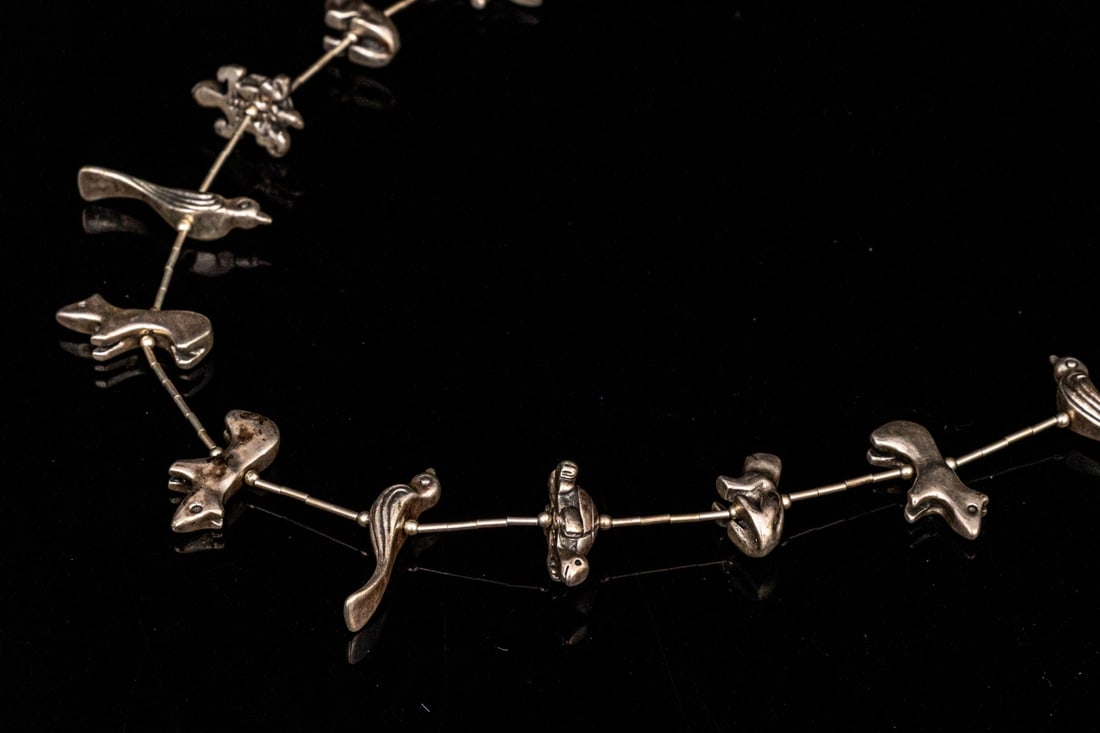 STERLING SILVER SOUTHWESTERN CHUNKY ANIMAL MOTIF OPERA LENGTH FETISH NECKLACE: Sterling silver fabulous chunky animal fetish motif necklace, finished with a shepherd's style hook Marks: None, tests sterling Dimensions: 30" long Weight: 61.3 gross dwt