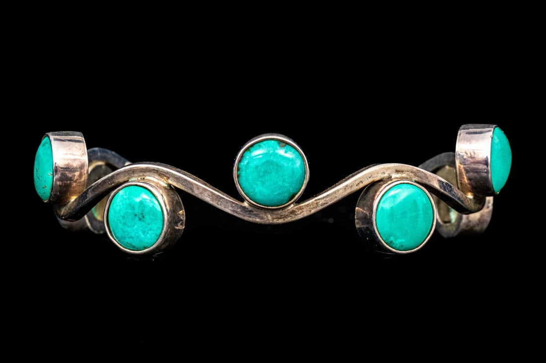 SOUTHWESTERN STERLING SILVER CONTEMPORARY STONE SET WAVE BRACELET: This sterling silver Southwestern motif cuff style bangle bracelet has a fabulous wave profile, set with alternating bezel set round cabachon blue charoite stones Marks: 925, Mexico Dimensions: 2 7/16