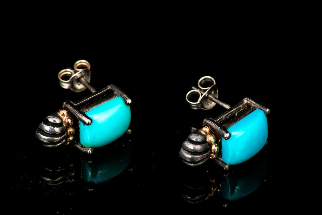 STERLING SILVER AND 14K YELLOW GOLD TURQUOISE CUSHION EARRINGS: These appealing sterling silver earrings feature a cushion cut turquoise top, prong set, decorated with a 14k yellow gold beaded center and completed with a ribbed sterling silver bottom. The earrings