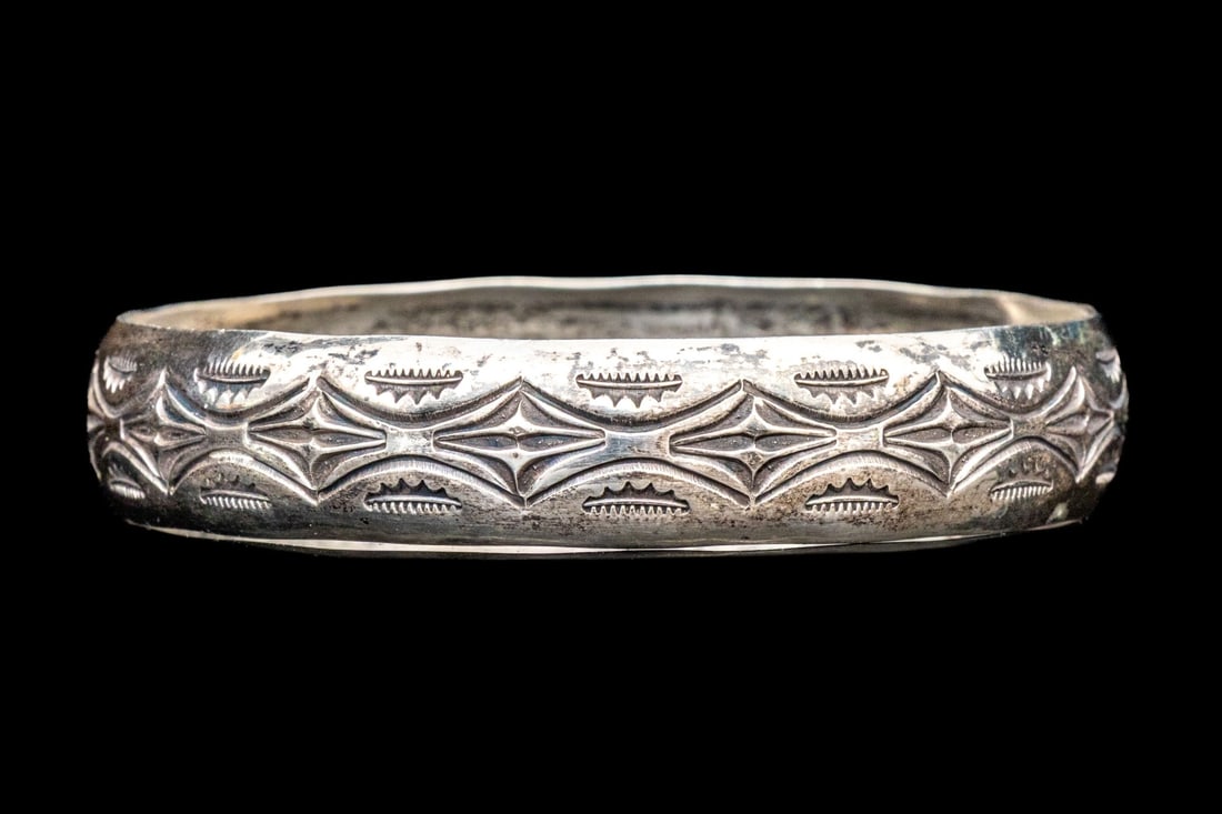 SOUTHWESTERN STYLE STERLING SILVER WIDE SLIP ON STYLE CHASED PATTERN BANGLE BRACELET: Sterling silver Southwestern style slip on bangle bracelet, chased patterning Marks: Sterling Dimensions: 2 9/16" interior diameter x 1/2" wide Weight: 16..3 gross dwt