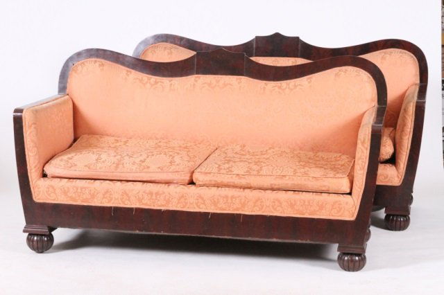 PAIR OF CLASSICAL STYLE SETTEES: Well figured mahogany, fitted with two cushions, supported on gourd form feet, late 19th century, well constructed, 65 1/2" long x 27 1/2" deep x 35" high