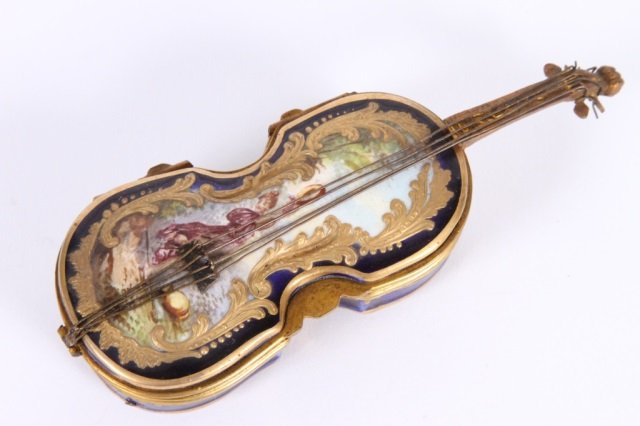 SEVRES VIOLIN FORM DRESSER / PILL BOX: with raised gilt and scenic paint decoration, 5" long