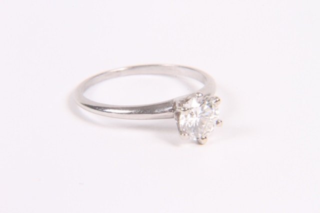TIFFANY & Co .9 KARAT DIAMOND ENGAGENMENT RING: Old European round brilliant cut with platinum setting, marked Tiffany & Co.