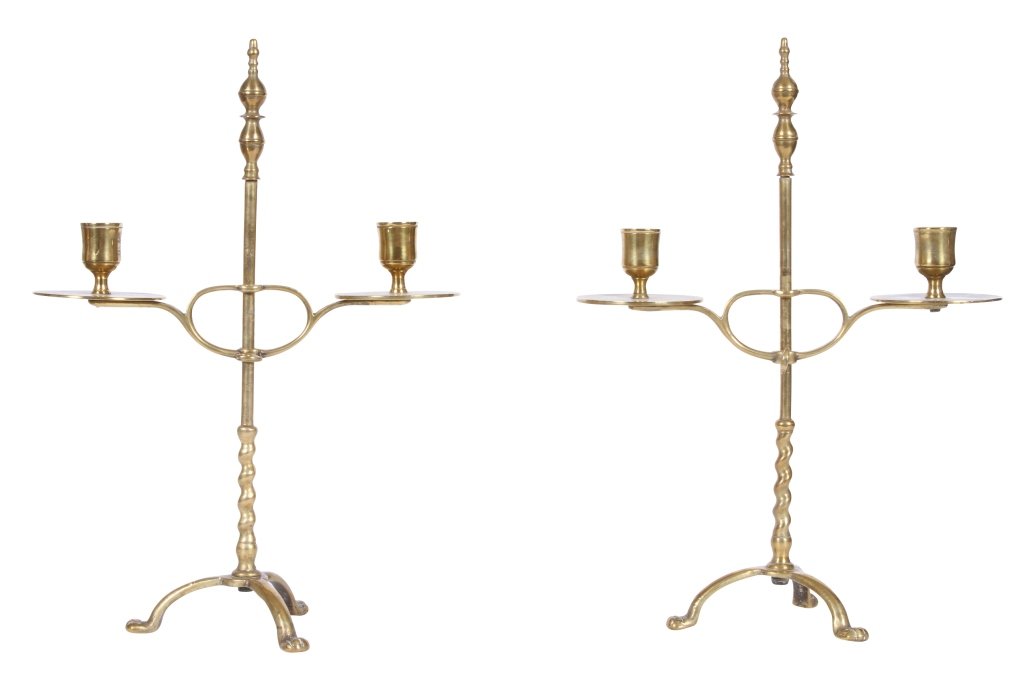 PAIR OF 18TH CENTURY ADJUSTABLE BRASS CANDLESTICKS: English or American, with double lemon top finials, adjustable candle holders with flat drip plates, supported on a twisted pedestal ending in paw feet, 15" highFrom the Estate of Thomas and Betty Mel