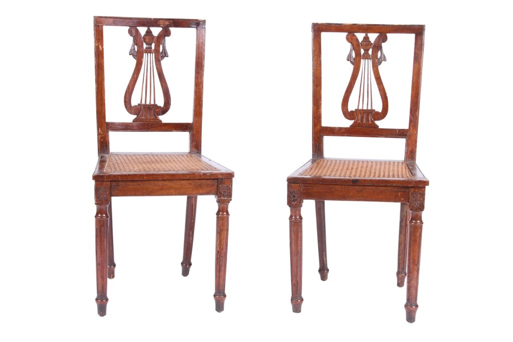 PAIR OF LOUIS XVI SIDE CHAIRS: Carved walnut with lyre backs, caned seats, raised on fluted legs, late 18th century, 34" h x 16" w x 15" d