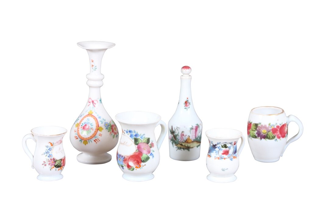 GROUP OF SIX ANTIQUE CONTINENTAL TABLE ARTICLES: Opaline glass with painted floral decoration, 3 1/2" tankard hairline crack to side and handle, 3 1/2" tankard hairline crack to handle, 4" tankard large hairline spider crack, 4 3/4" tankard good con