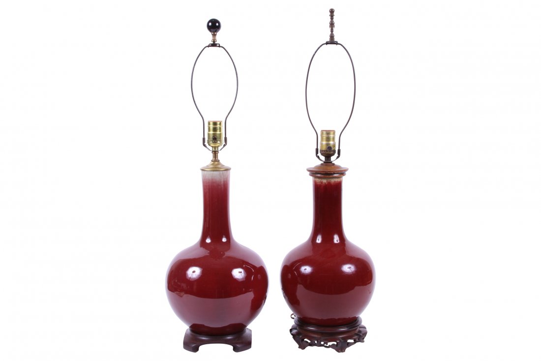 Two Similar Late Chinese Sang De Boeuf Glazed Porcelain: Two Similar Late Chinese Sang De Boeuf Glazed Porcelain Bag Form Vases "Coordinating pair with slight variations now mounted as table lamps. Bases drilled. larger measures 8 1/2" x 27 3/4" with simple