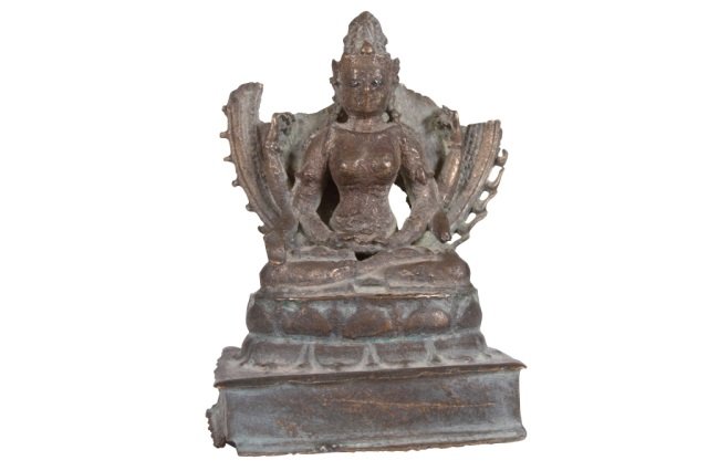 An Indonesian Cast Bronze Figure Of Devi: An Indonesian Cast Bronze Figure Of Devi On a lotus throne 9th-10th century A.D. 4 3/4" high