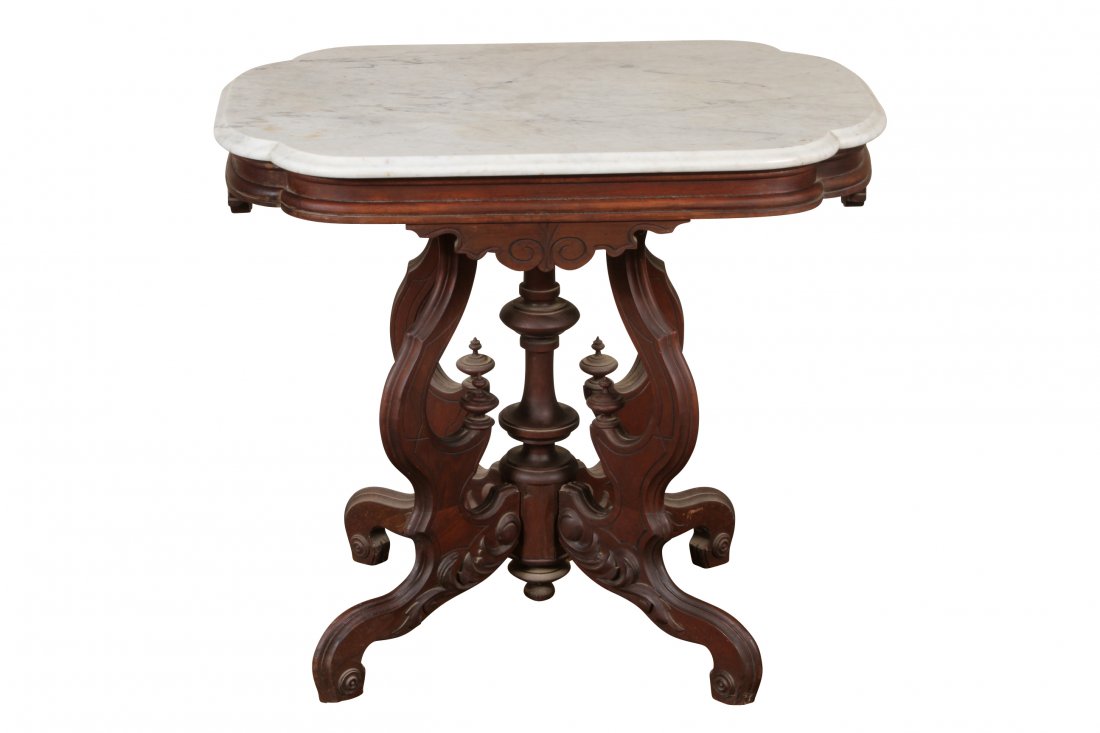 Antique Marble Top Victorian Table From The Watt /: Walnut with rococo carvings and turtle-form white marble top. Dimensions: 30 1/4"L x 20 3/4"D x 27"H Condition: Base slightly loose.