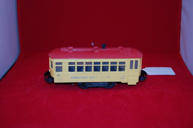 Lionel 60 Rapid Transit Trolley: Yellow with red roof.