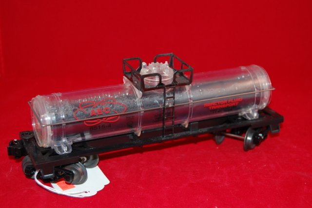 Lionel AEC Reactor Car 65154: Plastic with visible liquid.