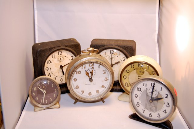 Mixed Lot of Vintage Non-Working clocks: Here is a nice mixed bag of clocks. Two are wartime Westclox which were made out of recycled paper. Non of the clocks run but most of the alarms work.