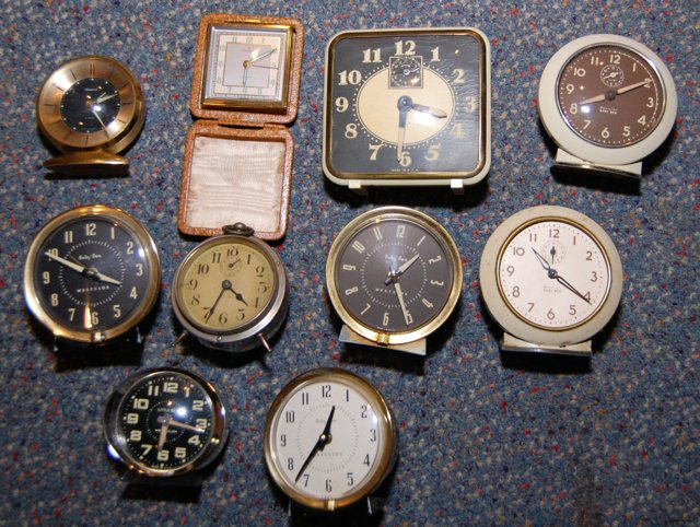 Large Lot of Small Alarm Clocks (Not Running): Here is a nice selection of clocks that could be repaired or used for parts. BabyBen and many others included. Most of the alarms work at the time of the auction.