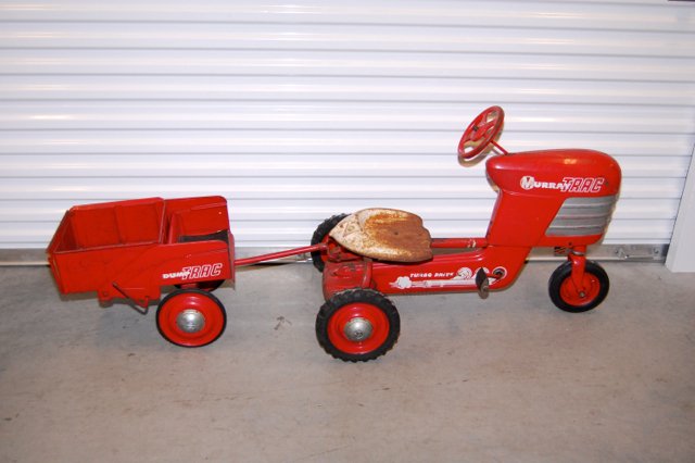Vintage Murray Trac Ride On Child's Tractor Toy: Here is a Murray Trac ride on toy in working condition. Please see the photos for condition. Comes with the dump trailer and a fire truck ride on accessory for a BMC firefighter fire truck which can b