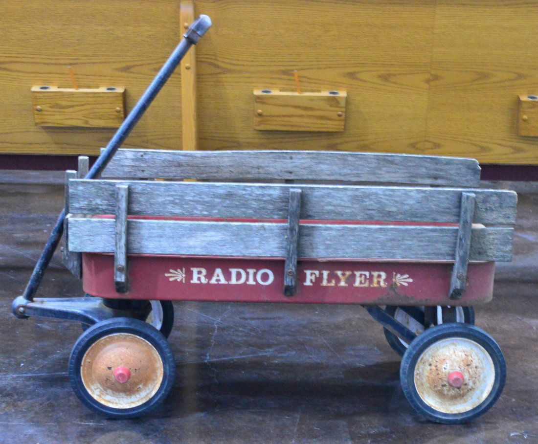 Vintage Radio Flyer Wagon: Vintage Radio Flyer Wagon with wooden rails. Estimated value is $50-75