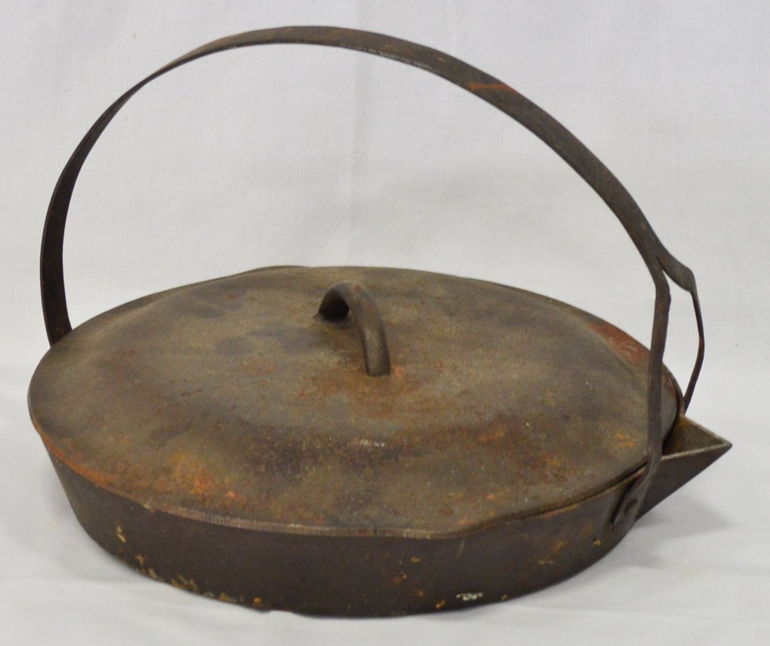 Cast Iron Open Fire Griddle with Lid: Measures 12" in diameter. Estimated value is $50-75