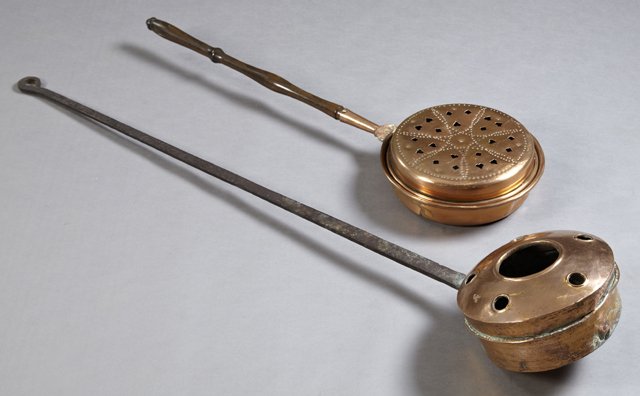Set of Two French Provincial Copper Bedwarmers: 19th c., with pierced lids, 1 with long iron handle, one with turned wood handle, Longest m. 4ft L