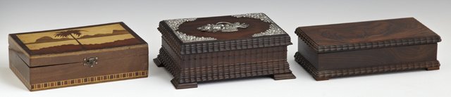 Collection of Dresser Boxes: Group of Three Dresser Boxes, consisting of a silver mounted carved rosewood example, 19th c.; a carved rosewood example, 19th c.; and an inlaid mahogany example, early 20th c., Silver Mounted- H.- 3 