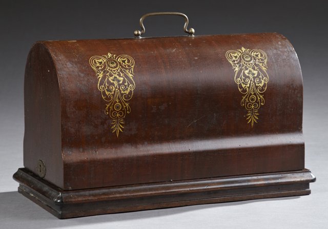 Inlaid Mahogany Cast Iron Sewing Machine: Portable Sewing Machine, 19th c., in arched bent wood case, with key, 11.5in H, 19.75in W
