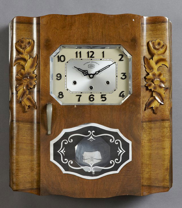 Carved Walnut Art Deco Wall Clock: Carved Walnut Art Deco Wall Clock, c. 1940, time, strike and Westminster chime, with a chromed pendulum and octagonal face rim, H.- 21 1/2 in., W.- 19 1/2 in., D.- 6 3/4 in.