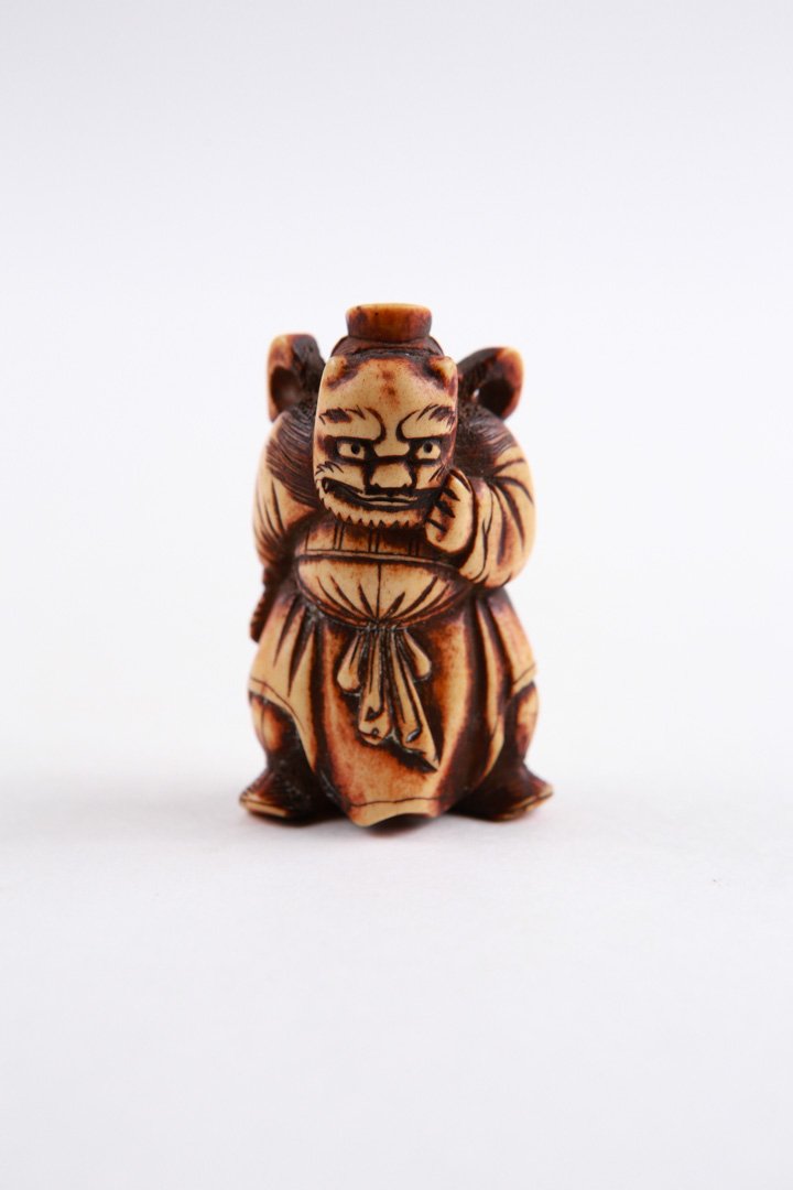 Very Old Netsuke Ivory Masked Figure: Japanese Netsuke Ivory of masked figure, very old, m. 2.25in H. SEE TERMS AND CONDITIONS REGARDING IVORY PURCHASES.