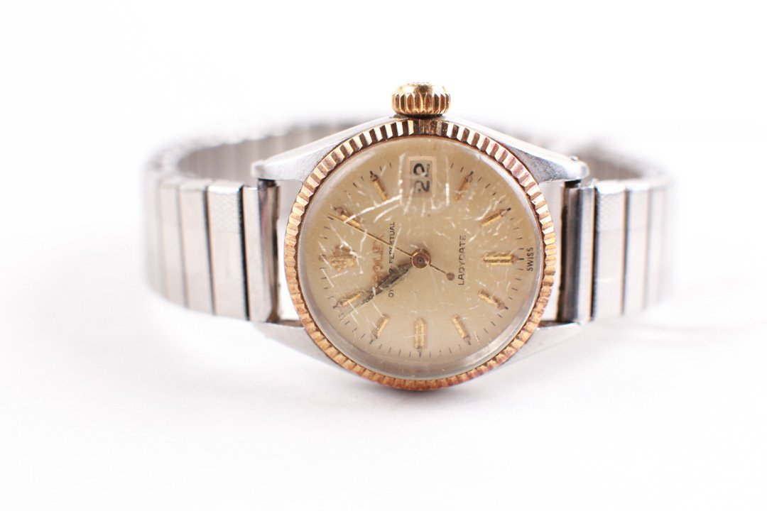 Mid Century Ladies Rolex Watch: Perpetual, model 6517, serial # 627701, original band, face 1in diameter, needs repairs